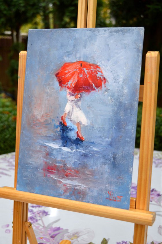 A girl running through puddles