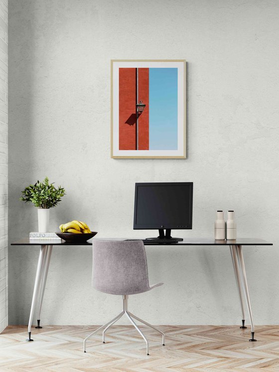 Red wall with a lamp