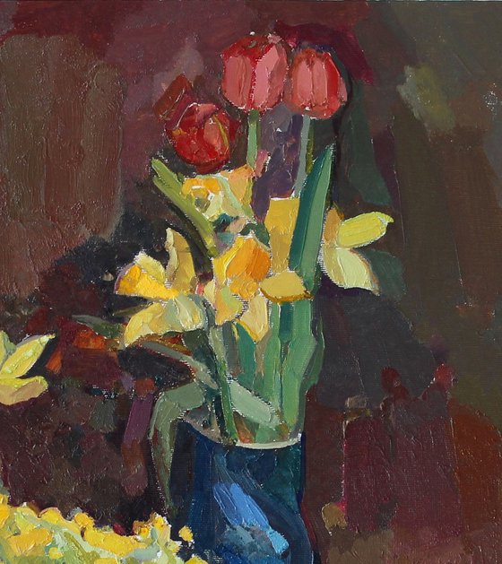 Yellow flowers with tulips