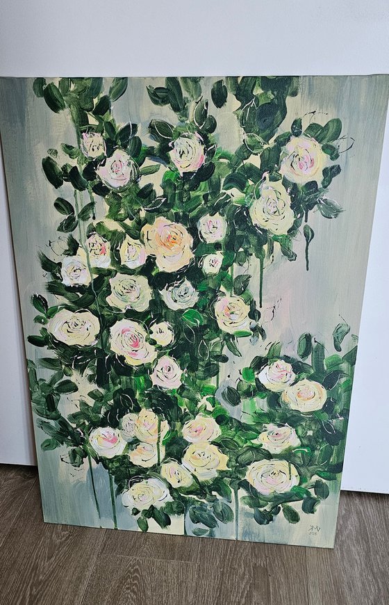 Blooming abstract rose garden in pale yellow