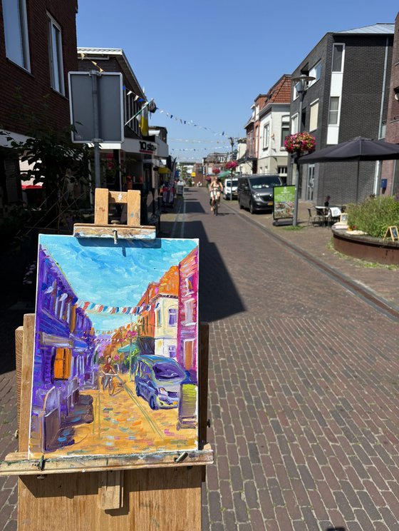 Festive Dutch town scene with cyclist