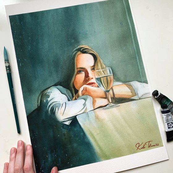 A woman with a glass of wine