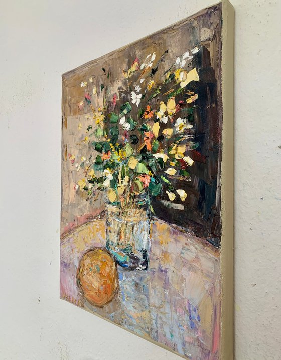Still life with flowers and orange