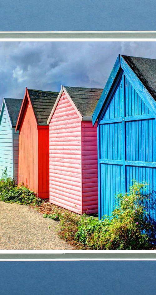 Beach huts in a row by Robin Clarke