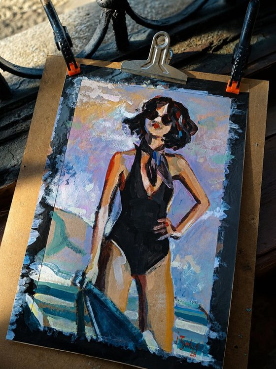 Girl in a black swimsuit On the beach