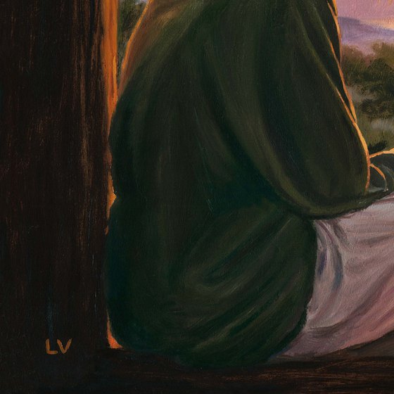 Girl watching the sunset with her tabby cat