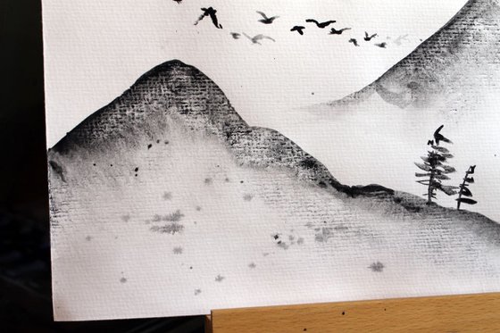 Mountains and flying birds