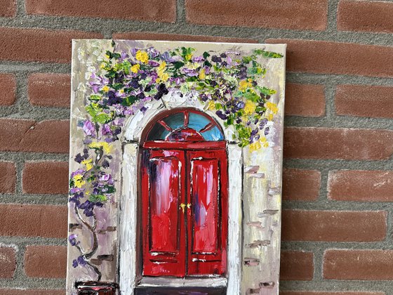 Red door with flowers