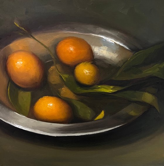 Citrus on a pewter plate