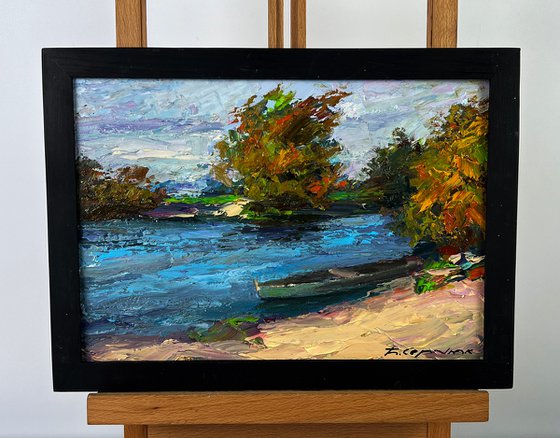 A Boat on the River Bank
