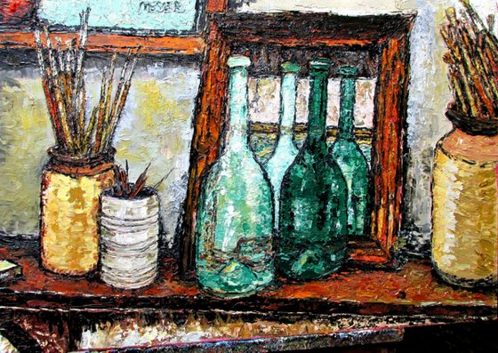 Bottles and brushes on a shelf with a mirror