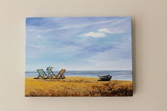 Three Deckchairs and a Boat
