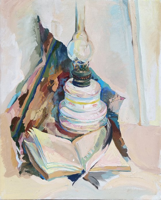 Still life with with lamp and book