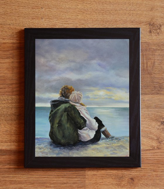 Couple in a cloudy seascape