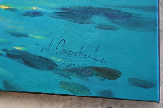 Moonrise in blue over sea