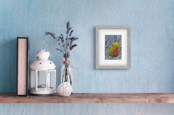Green pear on blue
