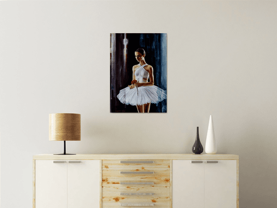 A ballet dancer with a red rose