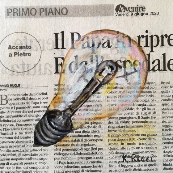 Light Bulb on Newspaper