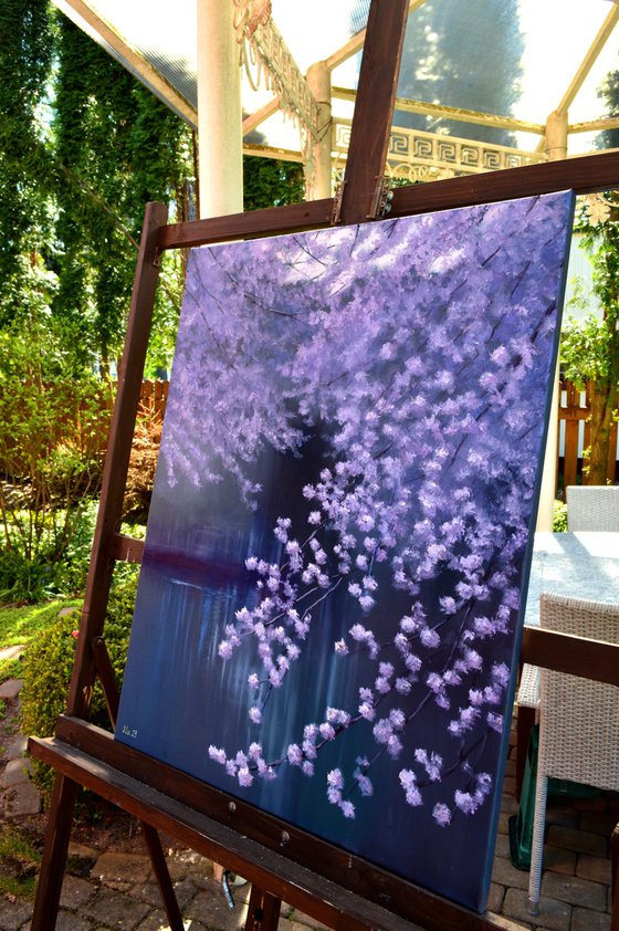 Blooming garden by the pond