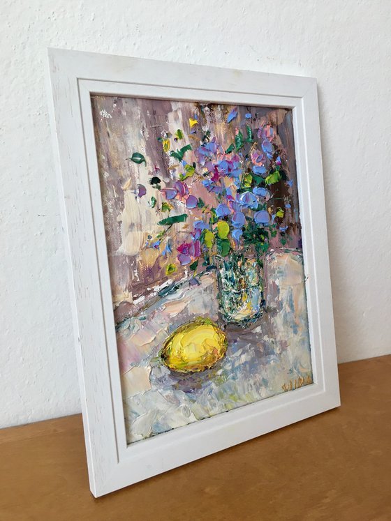 Still life with flowers and lemon