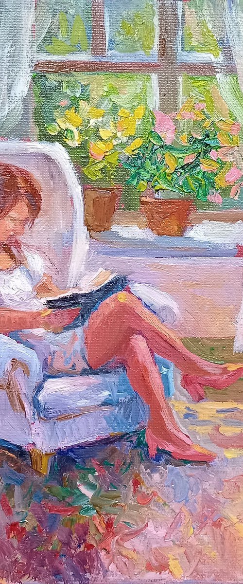 Reading a book by Ann Krasikova