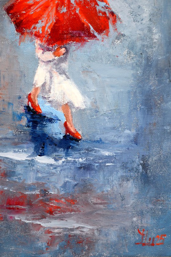 A girl running through puddles