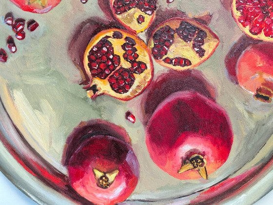 Pomegranates on metal try