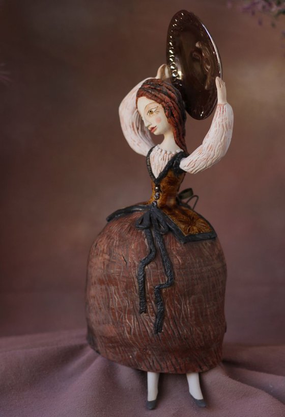 Girl with a shining plate. Wall ceramic sculpture by Elya Yalonetski.