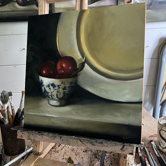 Plums and gold plate.