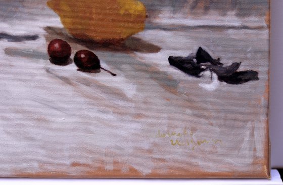 Composition with two lemons and a plum twig