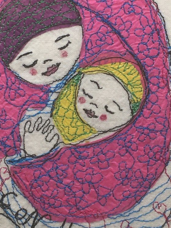 Mother and baby wrapped in a pink blanket.    Mixed media  Textile