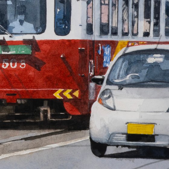 Red and White Tram in the City