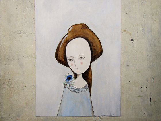 The woman with flowers on her shoulder