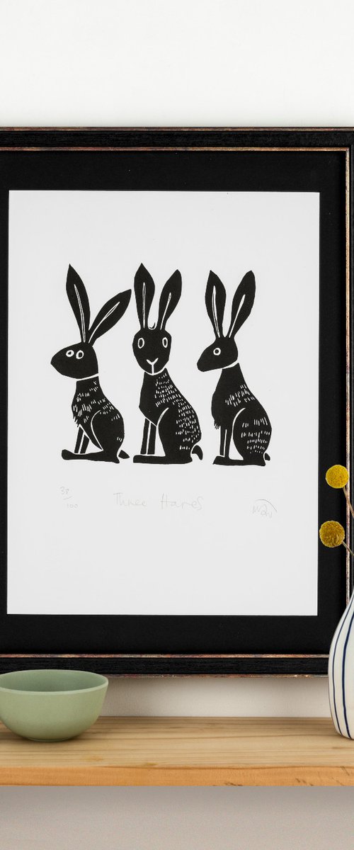 Three Hares - lino cut print by Melanie Wickham