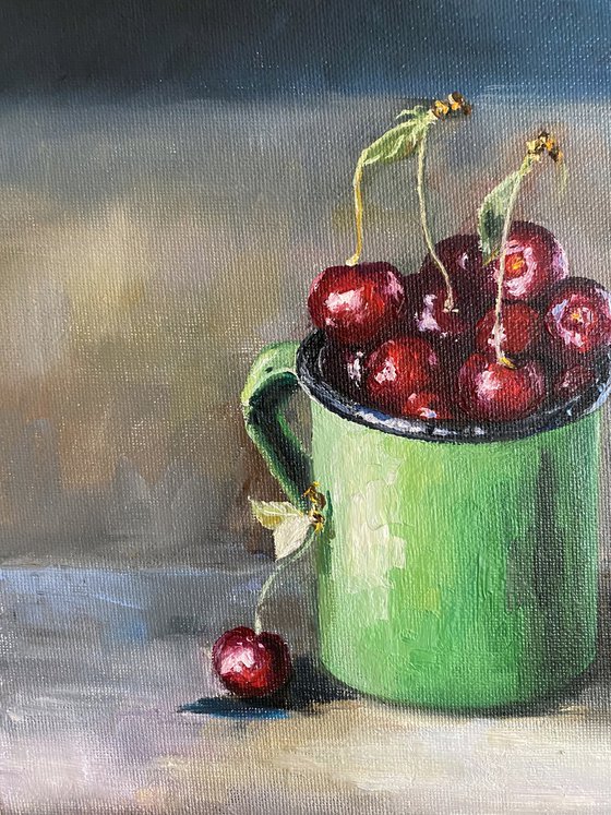 Cherry in a green cup