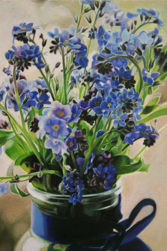 blue flowers in a jar