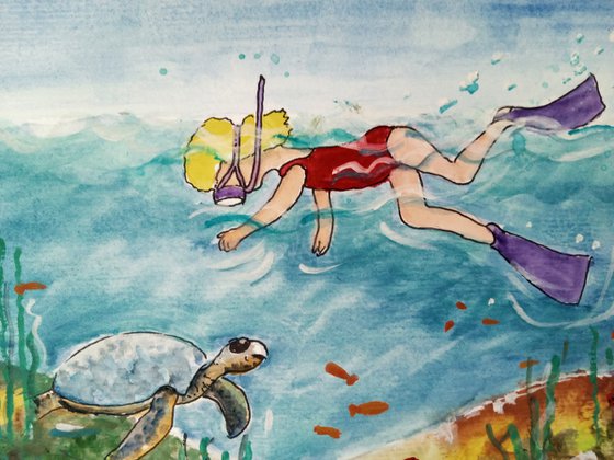 Girl Swimming amongst fishes and a sea turtle