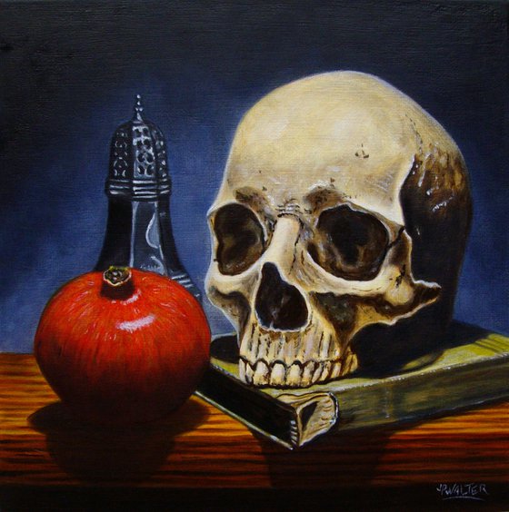 Skull on book with pomegranate