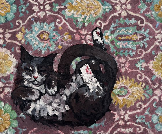 Black cat at the carpet