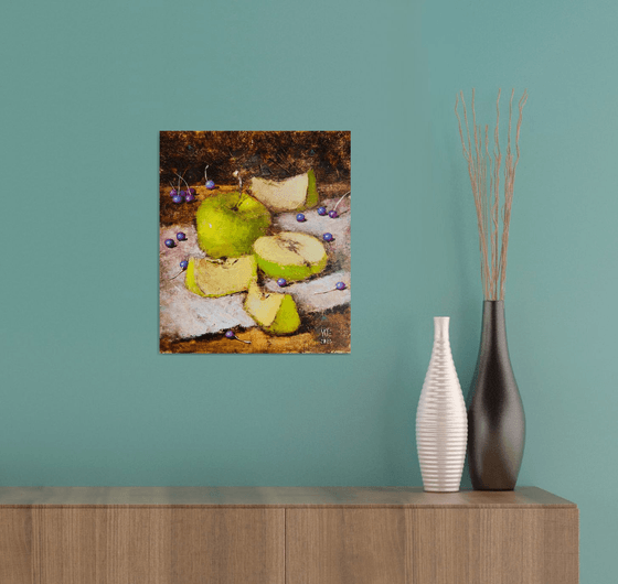 Green apples on dark