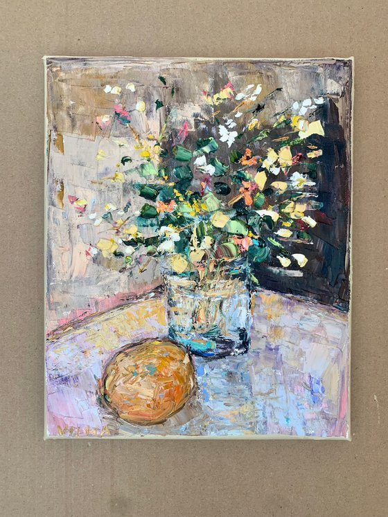 Still life with flowers and orange