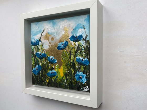 Blue poppies on gold leaf