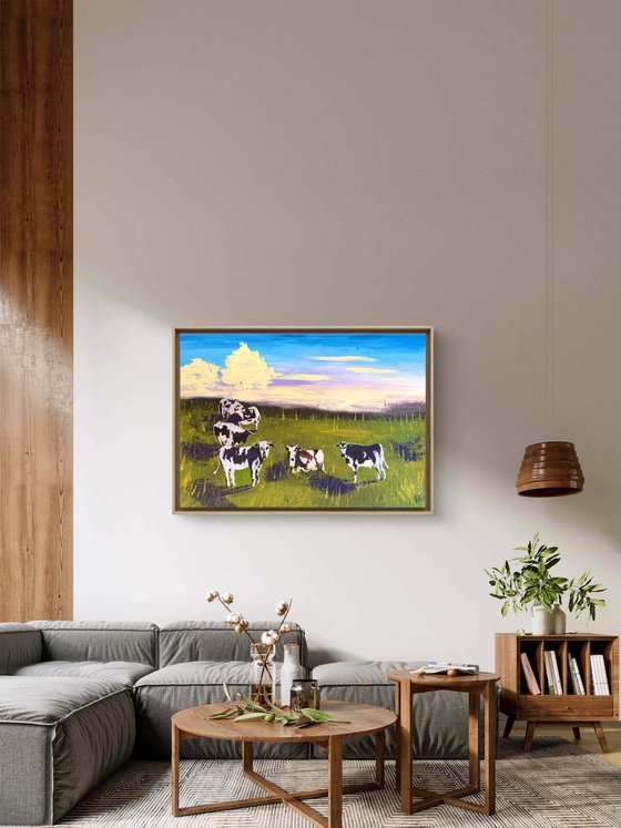 Cows grazing in the field