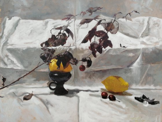 Composition with two lemons and a plum twig