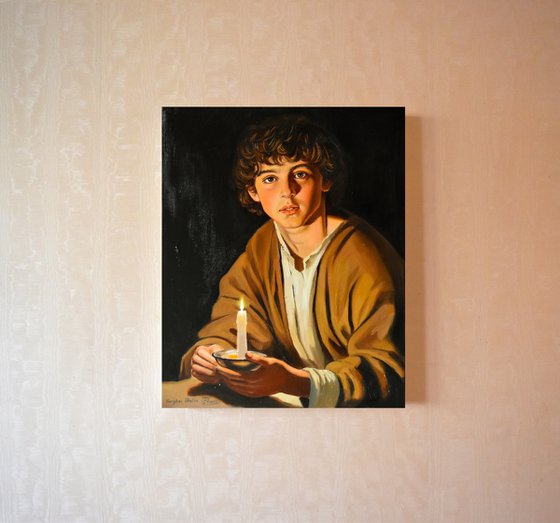 A boy with a candle