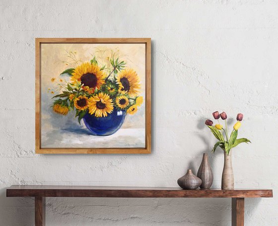 Sunflowers bouquet in a blue glass vase still life