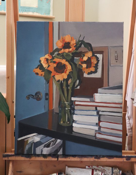 Still life with sunflowers and books