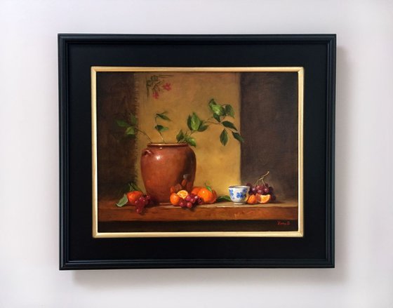 Still life with flower pot, tanderines and grapes. Framed painting. Oil on linen