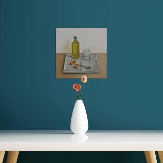 Olive oil bottle with cherry tomatoes