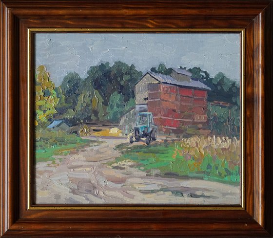 Blue tractor at the sawmill. Rodnya village
